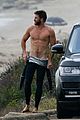 liam hemsworth bares his ripped abs while stripping out of wetsuit 23