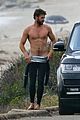 liam hemsworth bares his ripped abs while stripping out of wetsuit 24