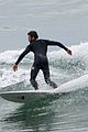 liam hemsworth bares his ripped abs while stripping out of wetsuit 27
