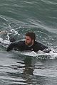 liam hemsworth bares his ripped abs while stripping out of wetsuit 32
