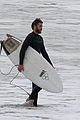 liam hemsworth bares his ripped abs while stripping out of wetsuit 33