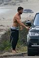 liam hemsworth bares his ripped abs while stripping out of wetsuit 37