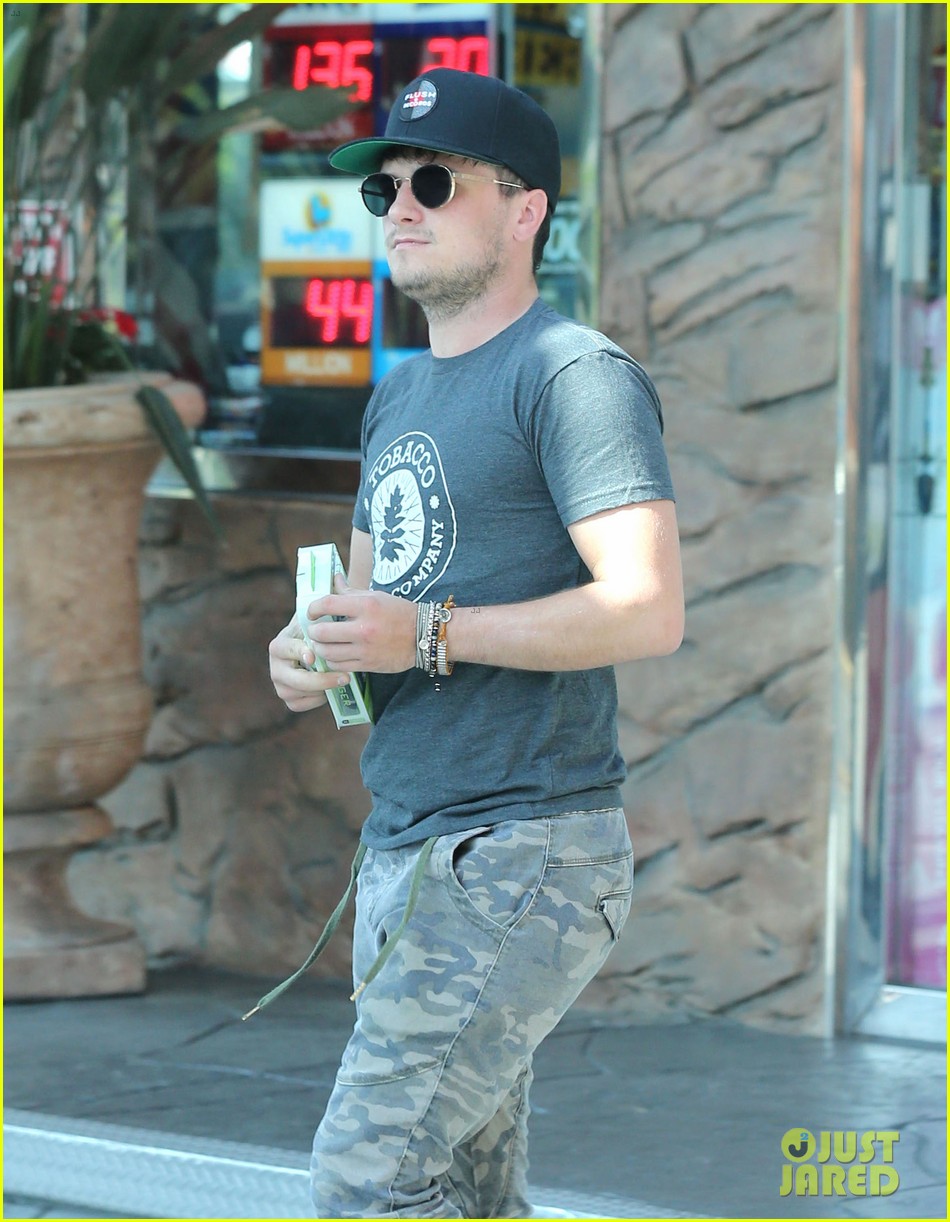 josh hutcherson fills up his car at a gas station in beverly hills 02