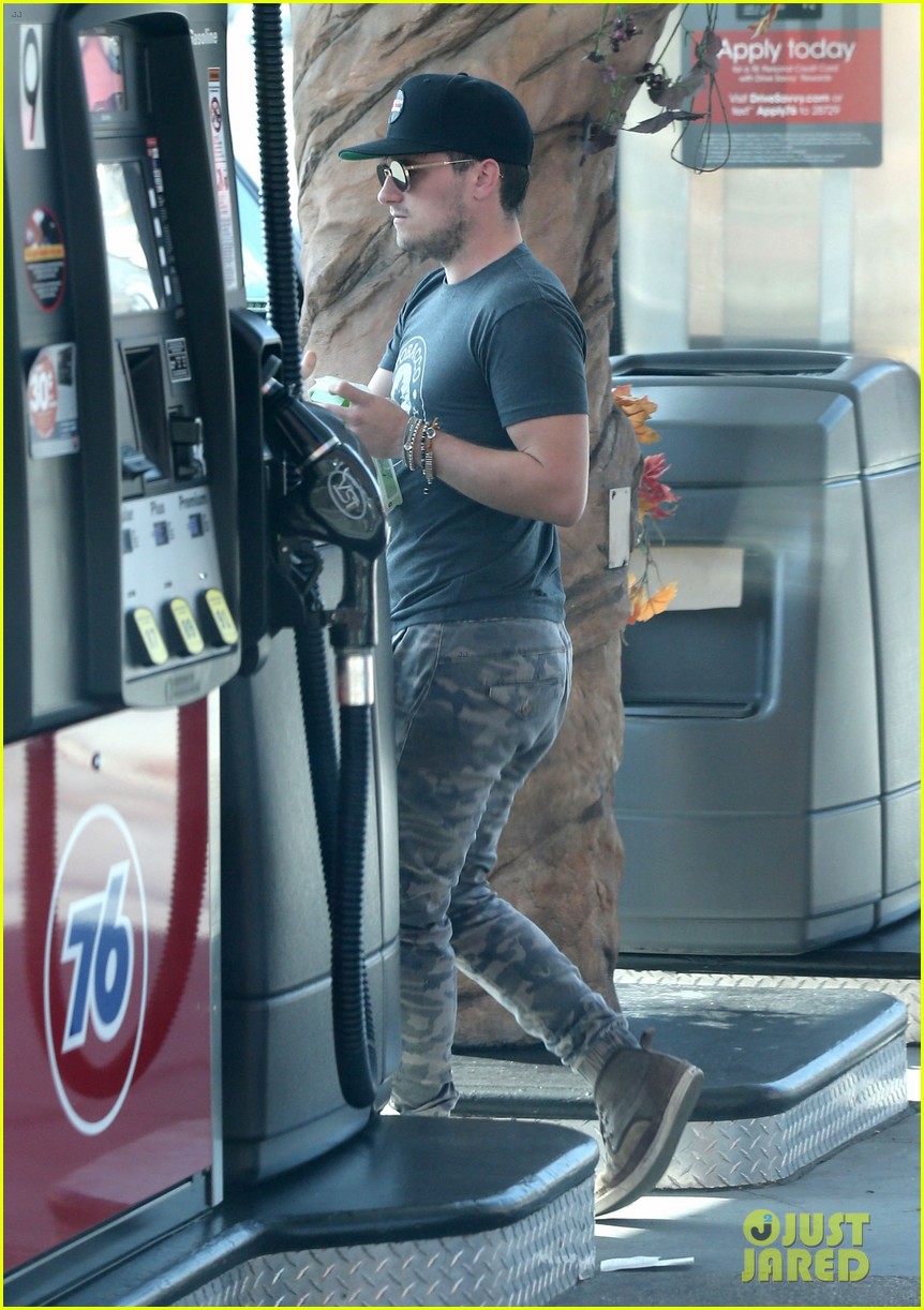 josh hutcherson fills up his car at a gas station in beverly hills 03