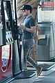 josh hutcherson fills up his car at a gas station in beverly hills 03