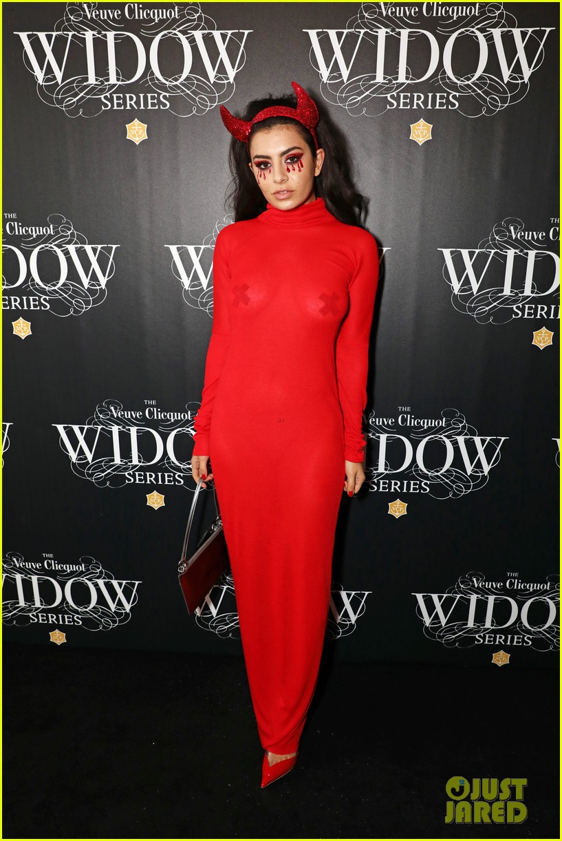 suki waterhouse steps out in a see through dress for halloween event 14