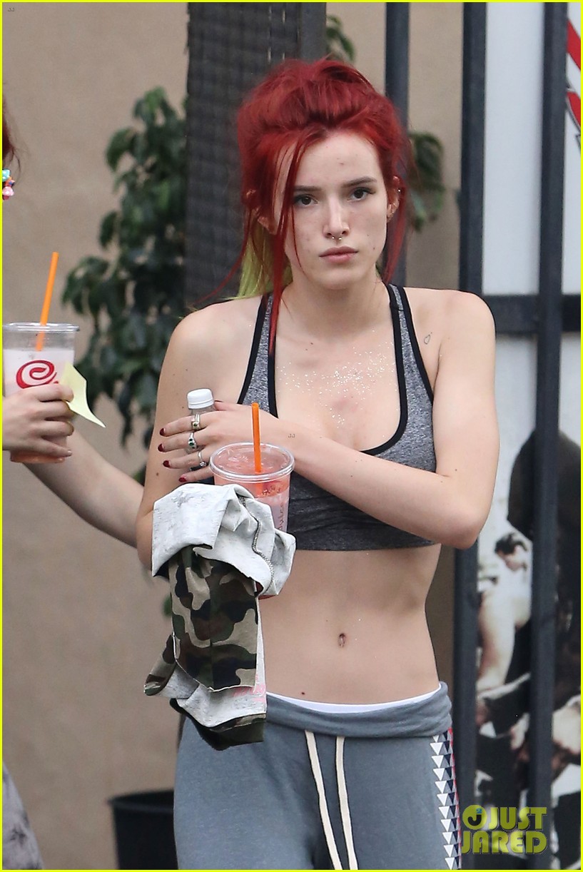 bella thorne shows off new bright red and yellow hair color at the gym 04