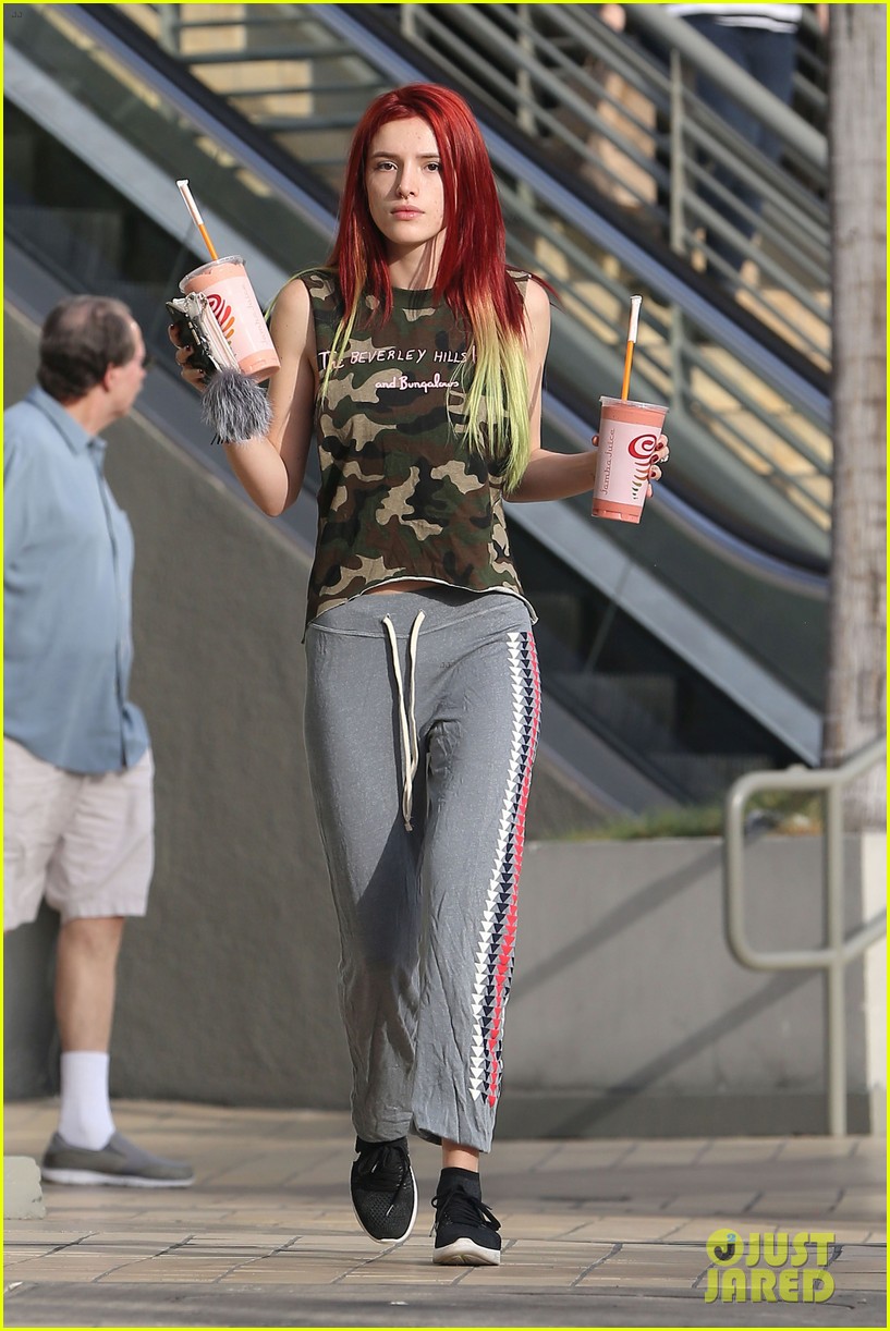 bella thorne shows off new bright red and yellow hair color at the gym 05