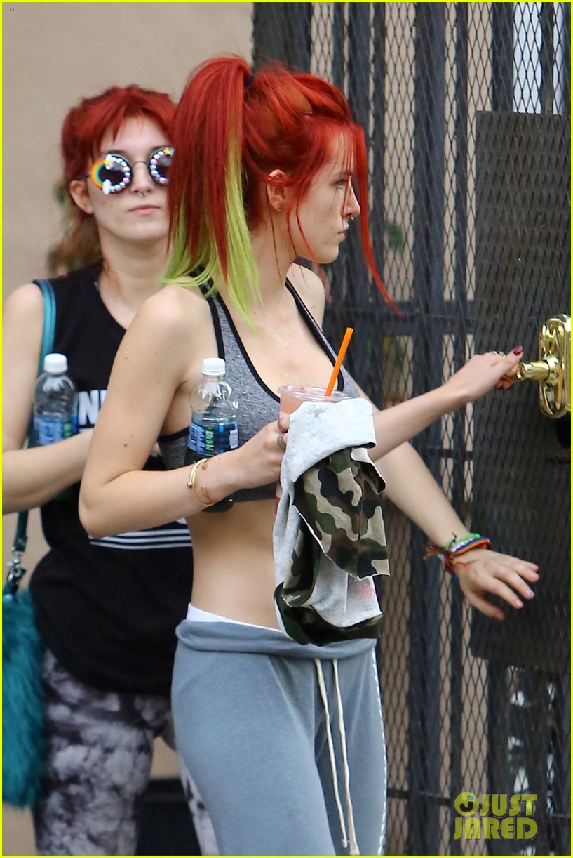 bella thorne shows off new bright red and yellow hair color at the gym 07
