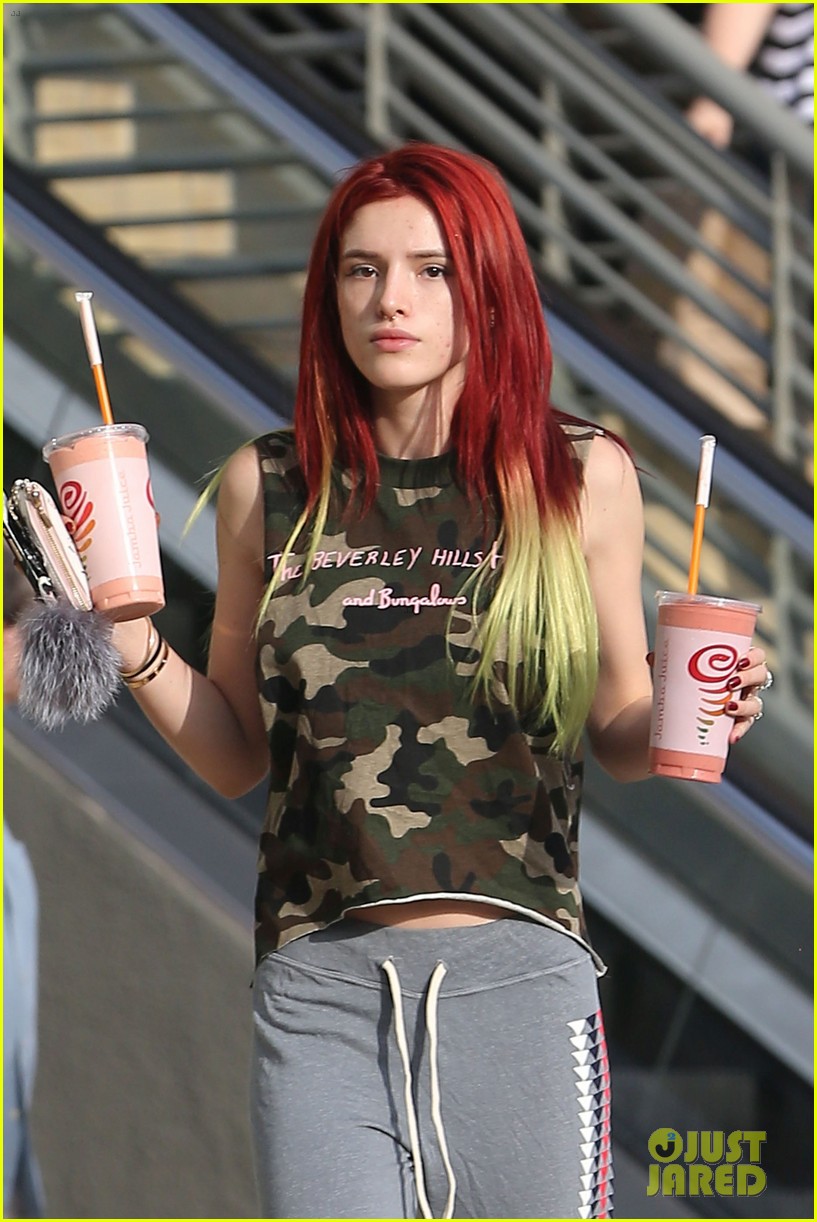 bella thorne shows off new bright red and yellow hair color at the gym 15