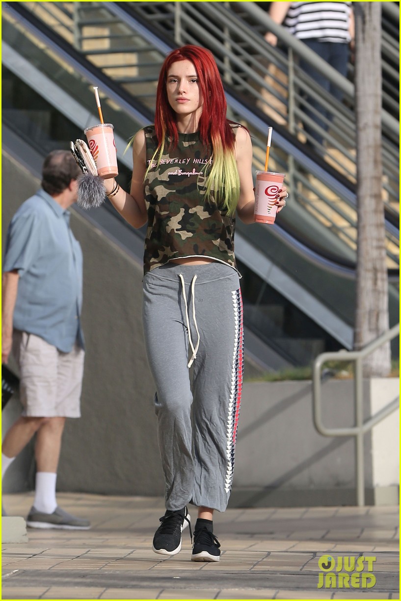 bella thorne shows off new bright red and yellow hair color at the gym 16
