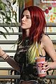 bella thorne shows off new bright red and yellow hair color at the gym 02