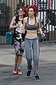 bella thorne shows off new bright red and yellow hair color at the gym 20