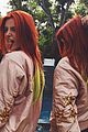 bella thorne dyes bright red hair 01