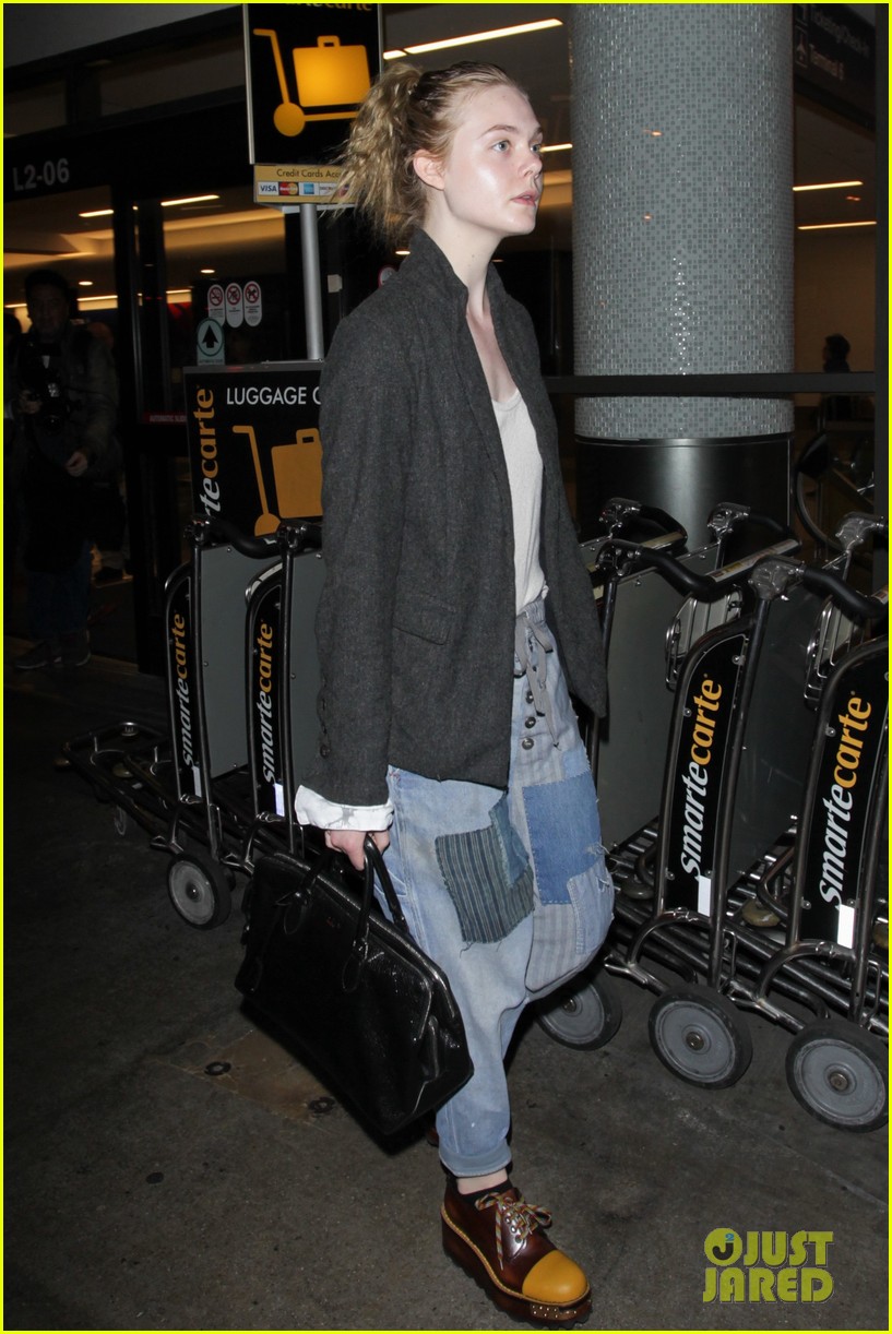 elle fanning super busy new film lax arrival pics 04