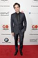 liam hemsworth robert pattinson and lily collins look sharp at go campaign gala 06