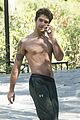 tyler posey goes shirtless as he works on his motorcycle 11