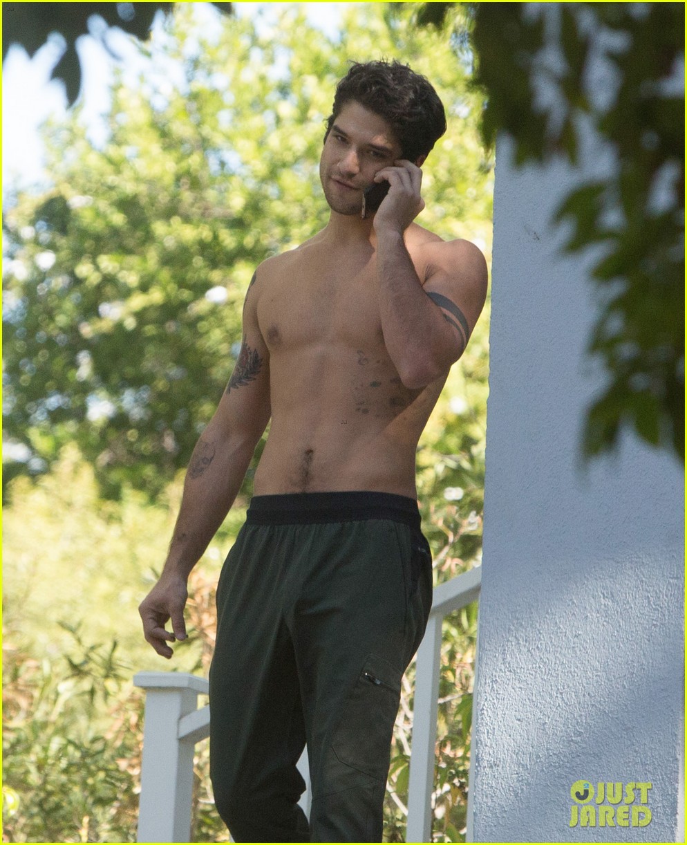 tyler posey goes shirtless as he works on his motorcycle 02