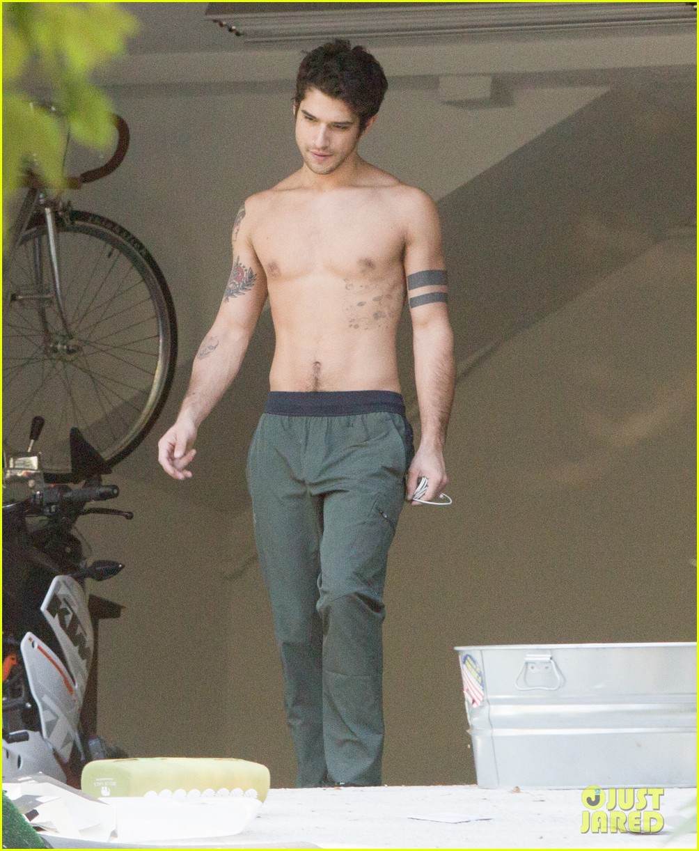 tyler posey goes shirtless as he works on his motorcycle 03