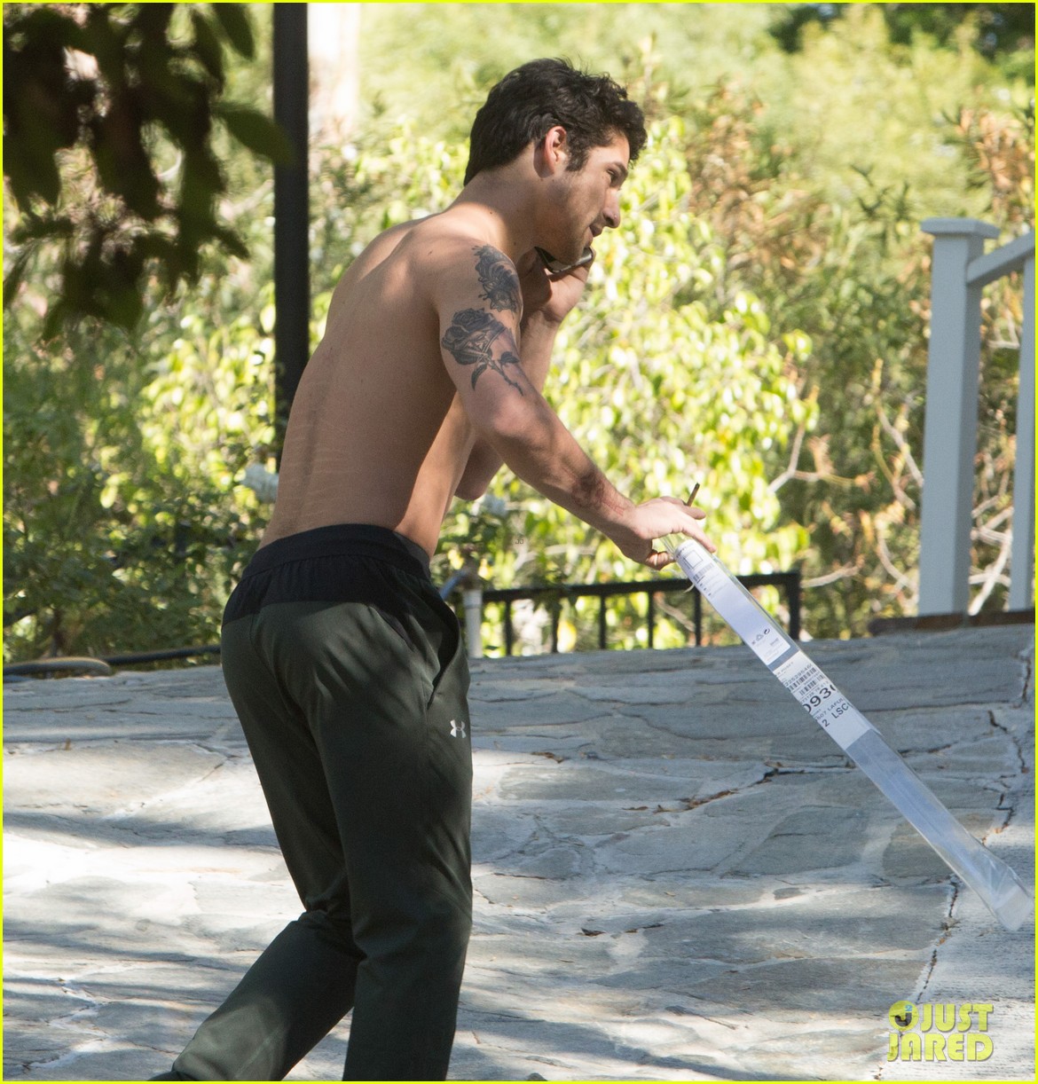 tyler posey goes shirtless as he works on his motorcycle 06