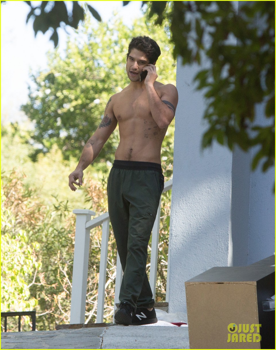 tyler posey goes shirtless as he works on his motorcycle 07