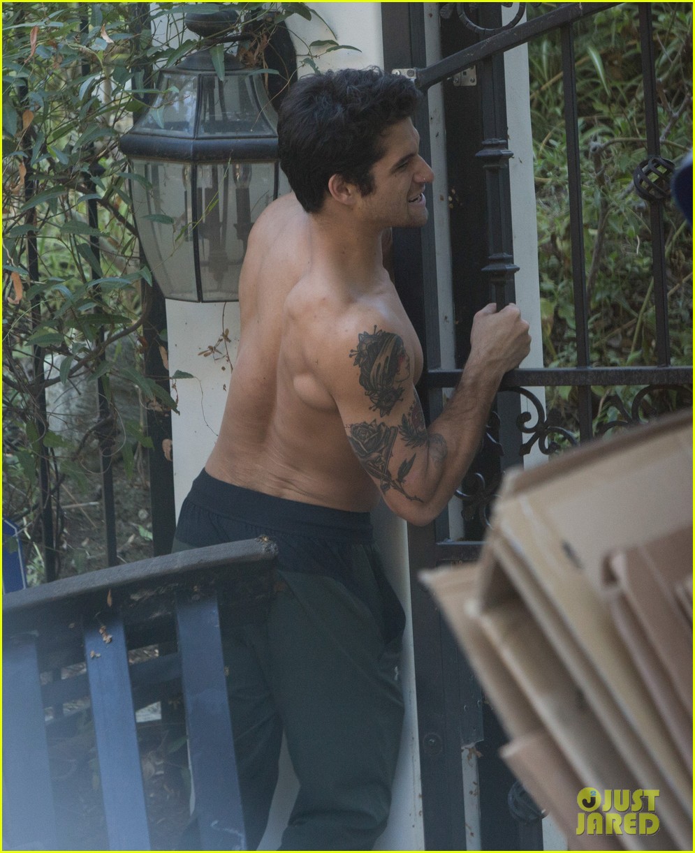 tyler posey goes shirtless as he works on his motorcycle 12