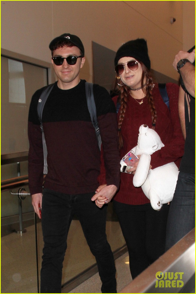 meghan trainor and daryl sabara hold hands while departing lax 03