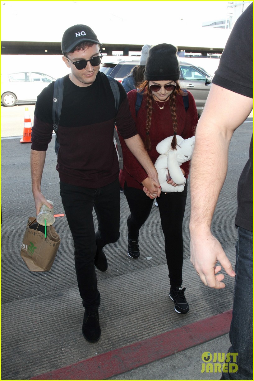 meghan trainor and daryl sabara hold hands while departing lax 04