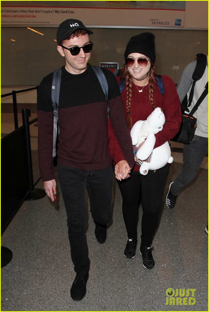 meghan trainor and daryl sabara hold hands while departing lax 07