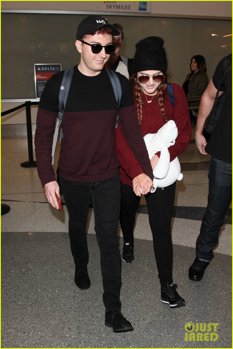 meghan trainor and daryl sabara hold hands while departing lax 09