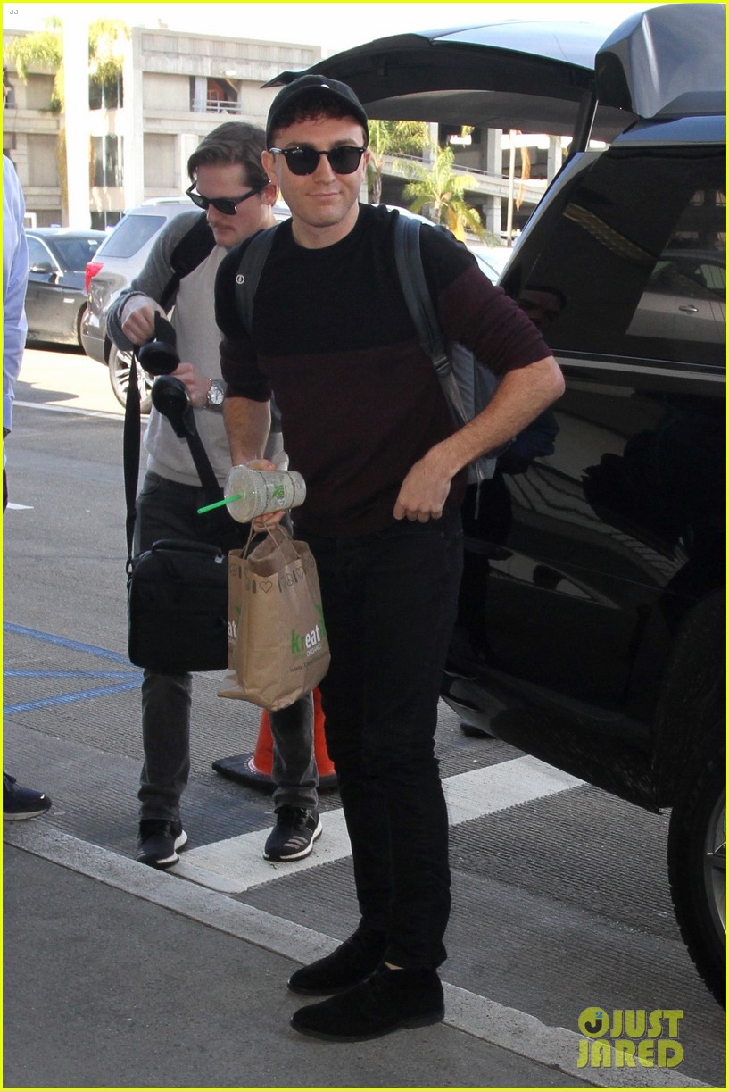 meghan trainor and daryl sabara hold hands while departing lax 10