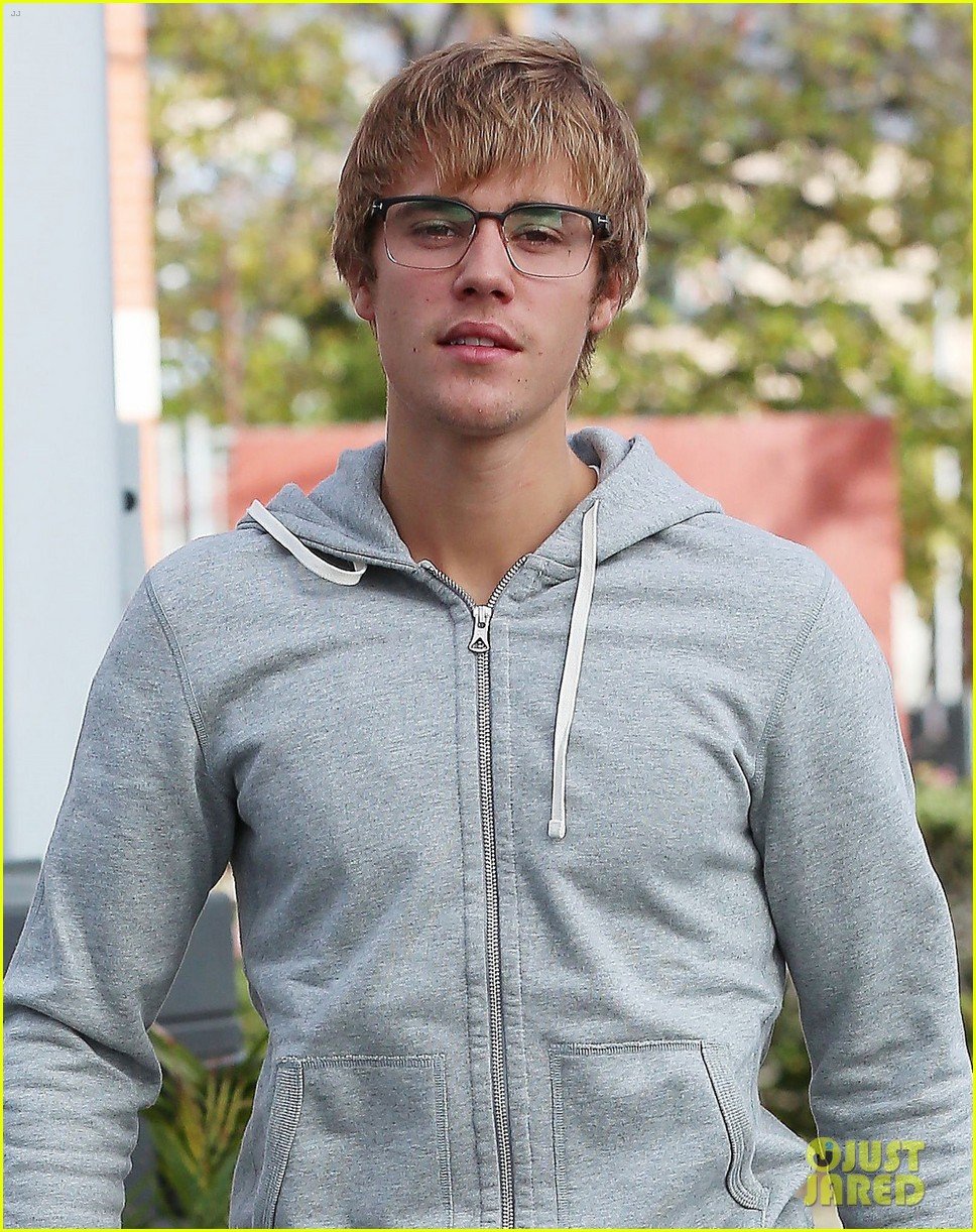 justin bieber gives the camera a swooning stare behind his glasses 01