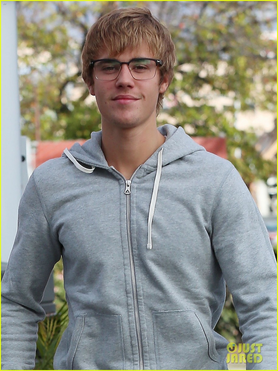 justin bieber gives the camera a swooning stare behind his glasses 03
