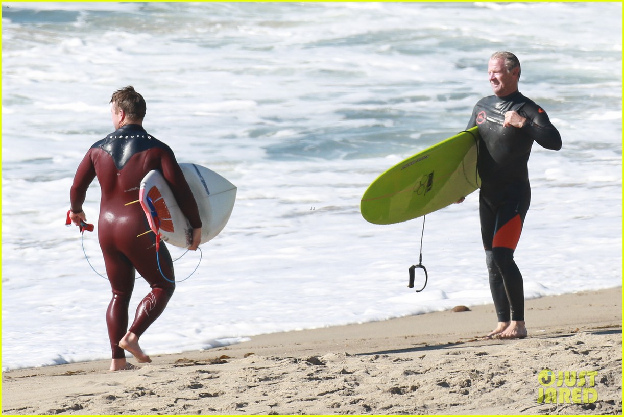 liam hemsworth and brother luke show off their wetsuit bods at the beach 02