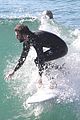 liam hemsworth and brother luke show off their wetsuit bods at the beach 01