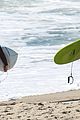 liam hemsworth and brother luke show off their wetsuit bods at the beach 02