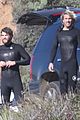 liam hemsworth and brother luke show off their wetsuit bods at the beach 03