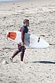 liam hemsworth and brother luke show off their wetsuit bods at the beach 05