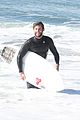 liam hemsworth and brother luke show off their wetsuit bods at the beach 06