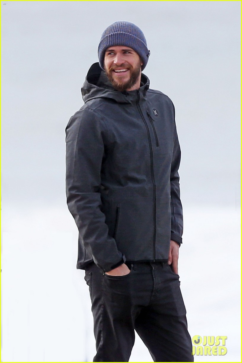 liam hemsworth and brother luke check out surf after socal storm 01