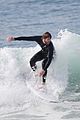 liam hemsworth flaunts his toned wetsuit bod while surfing see his wipeout pic 02