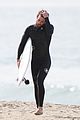 liam hemsworth flaunts his toned wetsuit bod while surfing see his wipeout pic 05