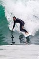 liam hemsworth strips shirtless surfing 04