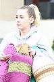 miley cyrus carries decorative pillows 04
