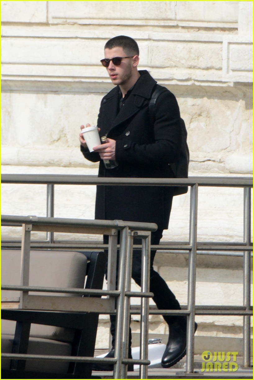 nick jonas defines dapper while drinking champagne on a boat in his turtleneck 06