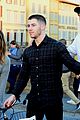 nick jonas defines dapper while drinking champagne on a boat in his turtleneck 03