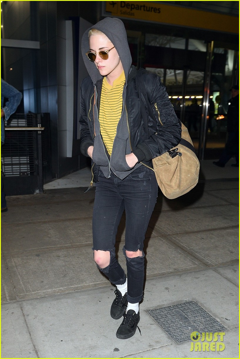 kristen stewart covers up new buzzed hair arriving in nyc 05