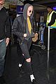 kristen stewart covers up new buzzed hair arriving in nyc 01
