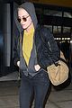 kristen stewart covers up new buzzed hair arriving in nyc 02