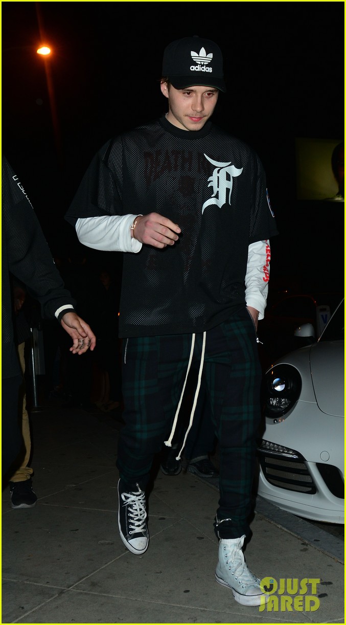 brooklyn beckham covers up his new tattoo during night out with friend 10